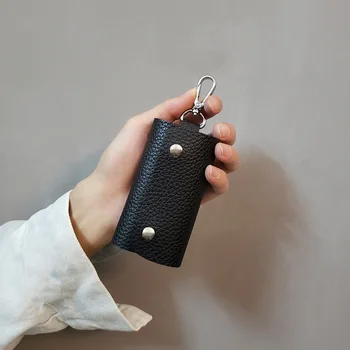 Anahtar çantası erkekler ve kadınlar için Kore versiyonu düz renk iş fırıldak yük moda koruyucu kapak toptan